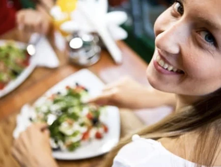 Woman showing food as part of a food freedom challenge