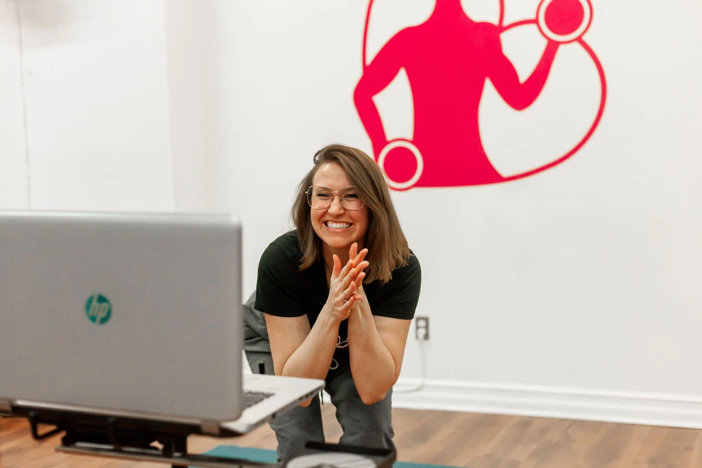 Woman teaching an online body positive fitness class