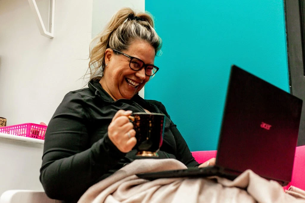 Personal wellness coach using a laptop to help students